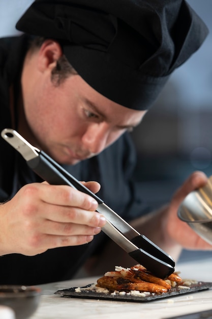 Male chef in kitchen cooking