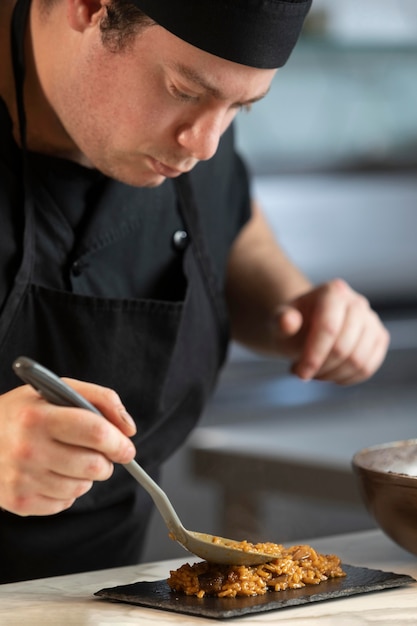 Male chef in kitchen cooking