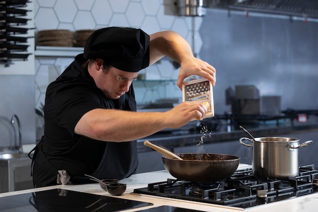 Male chef in kitchen cooking