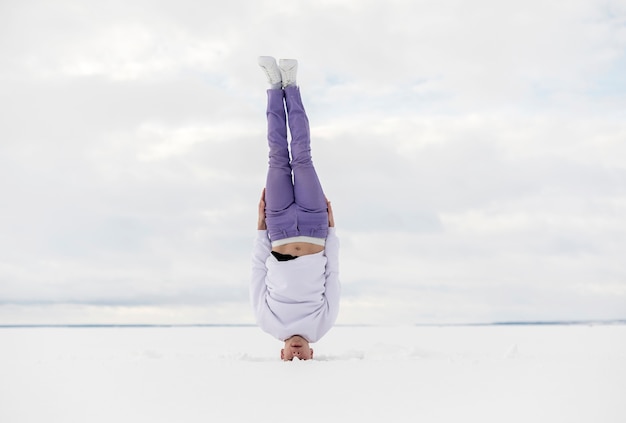 Free Photo male dancer standing on his head outside