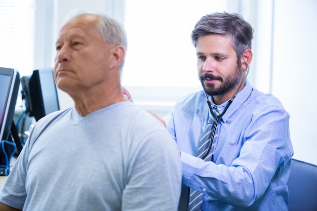 Male doctor examining a patient