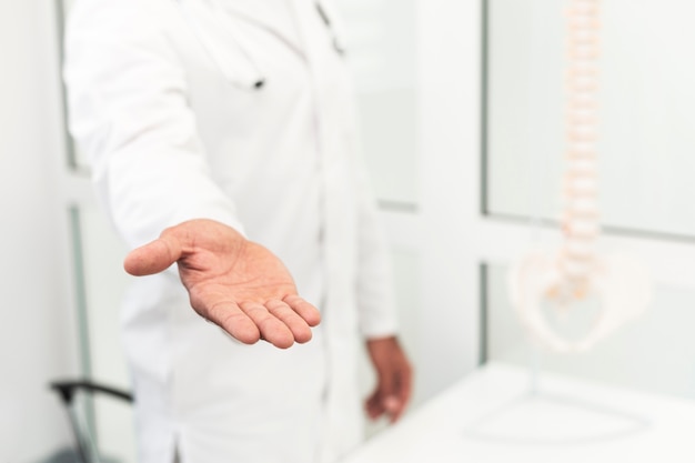 Free Photo male doctor offering his hand