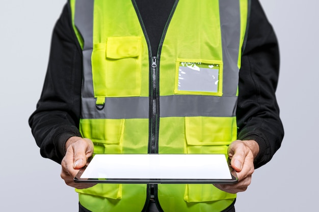 Free photo male engineer holding a digital tablet