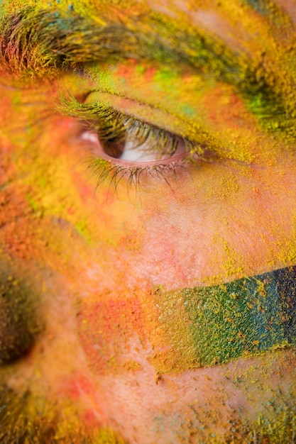 Free photo male face in rainbow powder