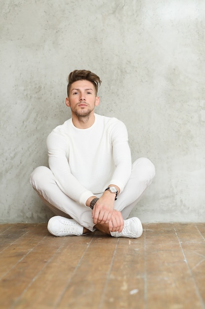 Free photo male fashion on wooden floor, young man posing