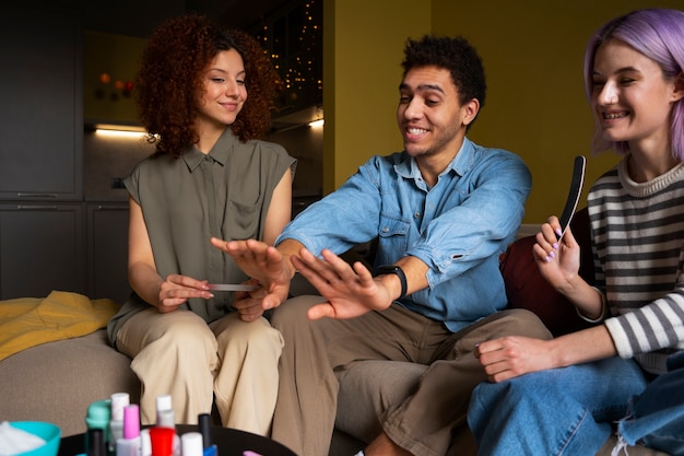 Male and female friends getting a manicure together