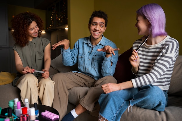 Male and female friends getting a manicure together