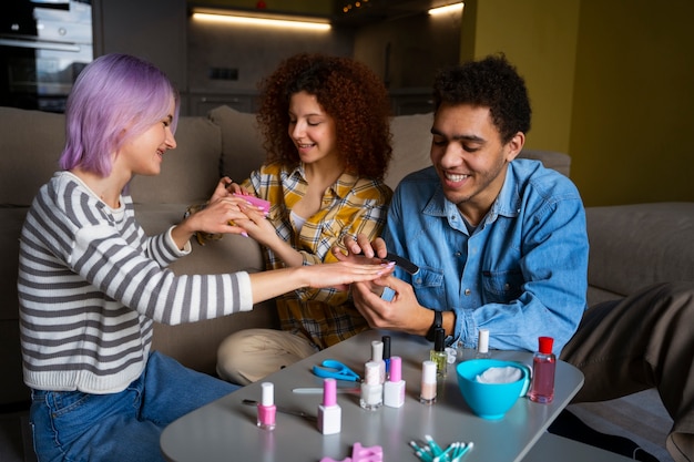 Male and female friends getting a manicure together