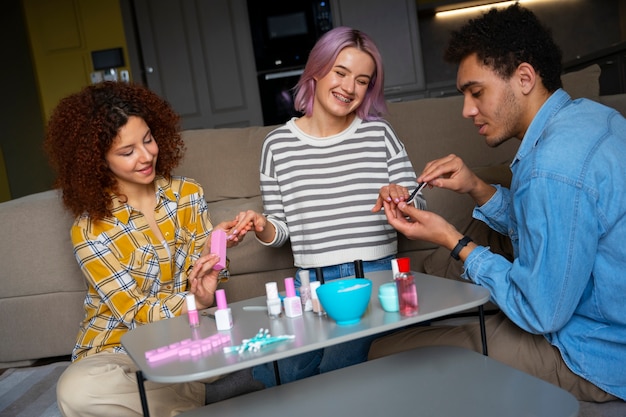 Male and female friends getting a manicure together