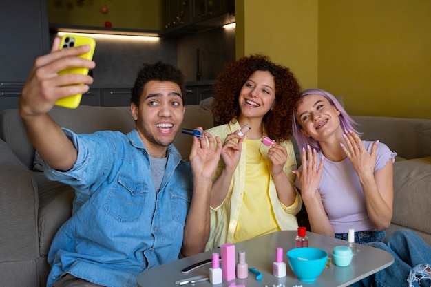 Free Photo male and female friends getting a manicure together