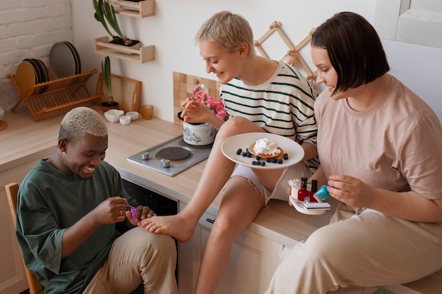 Male and female friends getting a manicure together