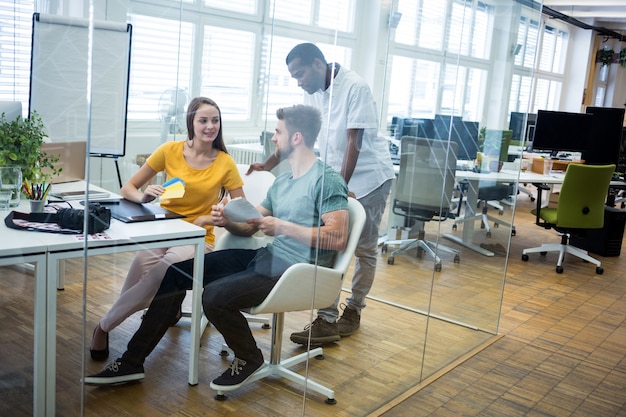 Free Photo male and female graphic designers interacting with each other