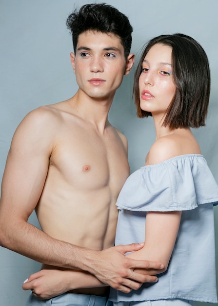 Male and female models posing together