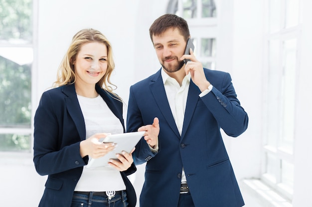 Male and female office workers.