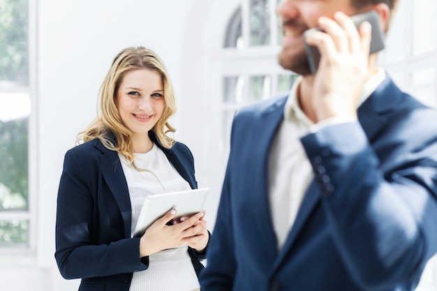 Male and female office workers.