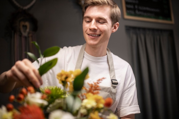 Male florist making a beautiful bouquet