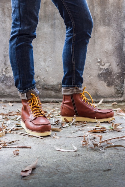 Free photo male foot with brown leather shoes and jeans