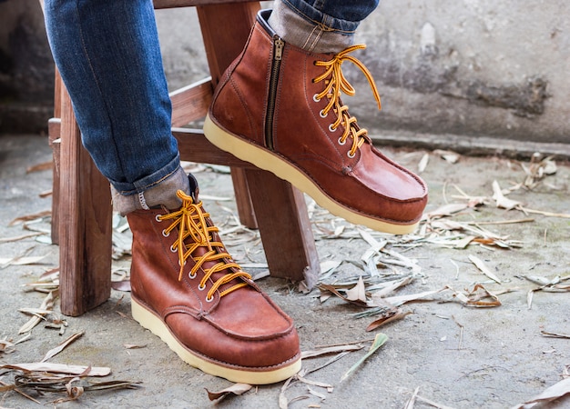 Free photo male foot with brown leather shoes and jeans