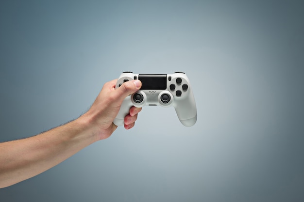 Free photo male hands holding gamepad