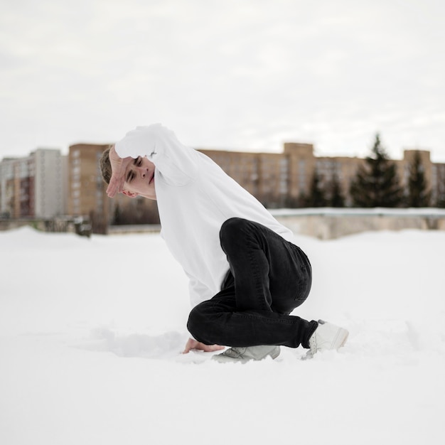 Male hip hop artists dancing in the snow