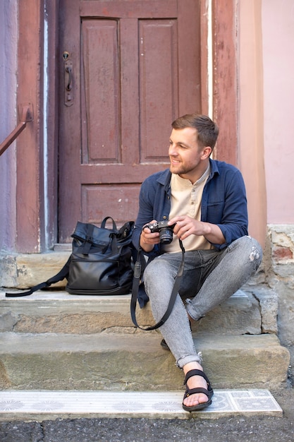 Male local traveler with a camera