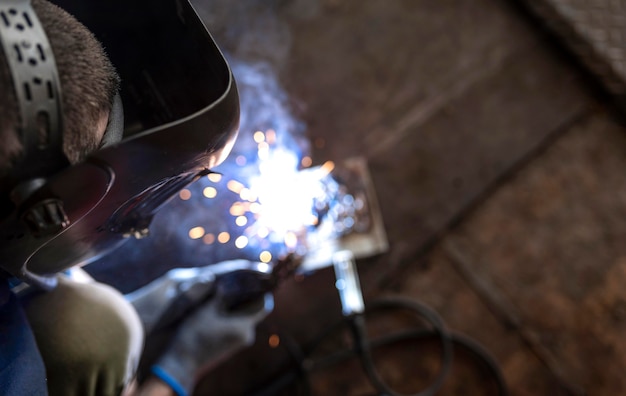 Male mechanic working at his workshop