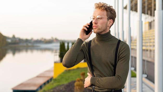 Male model looking away and talking on the phone