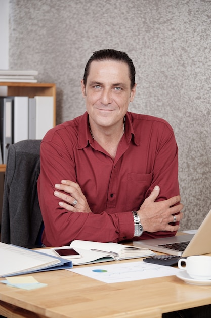 Male office worker sitting at desk