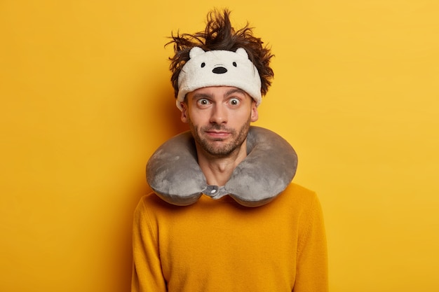 Free Photo male passenger wears travel pillow for sleeping during journey