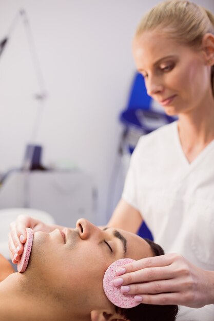 Male patient receiving massage from doctor