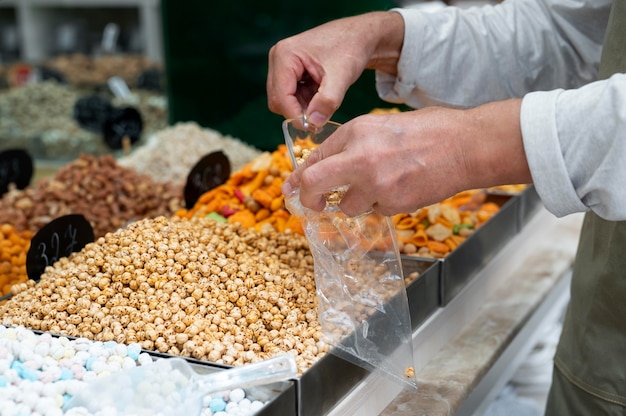 Male producer at his shop with different goodies