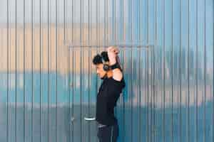 Free photo male sportsman warming up before training