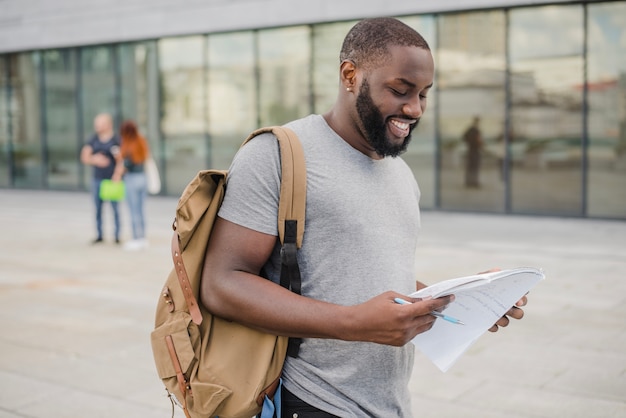 Male student holding papers