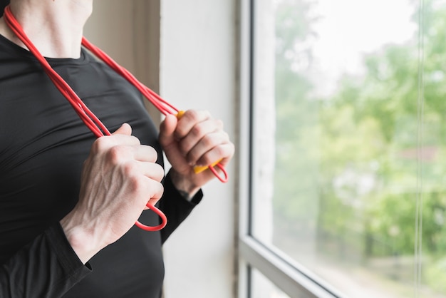 Free photo male with skipping rope on neck