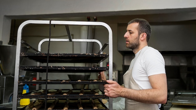 Male worker in a bread factory