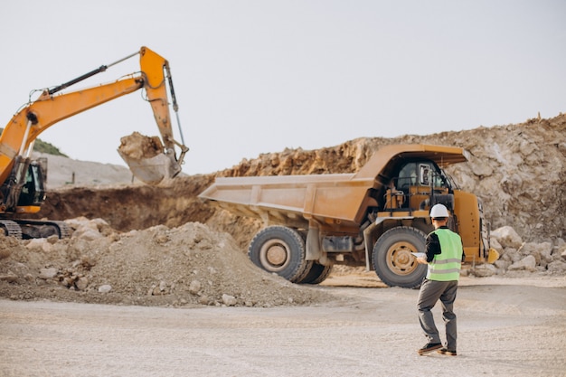 Free Photo male worker with bulldozer in sand quarry