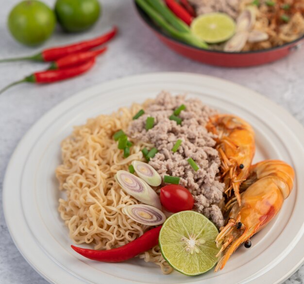 Mama and shrimp on a white plate.