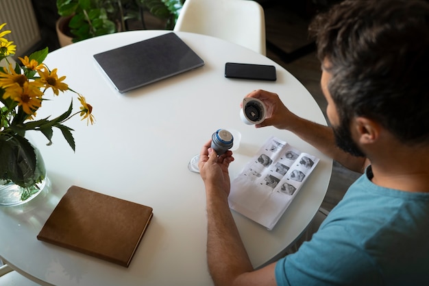 Free Photo man applying glucose patch sensor