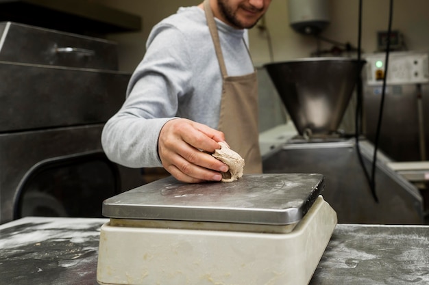 Free Photo man baking a fresh bread