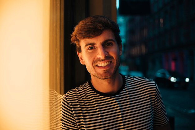 Man being outside and smile while looking at camera