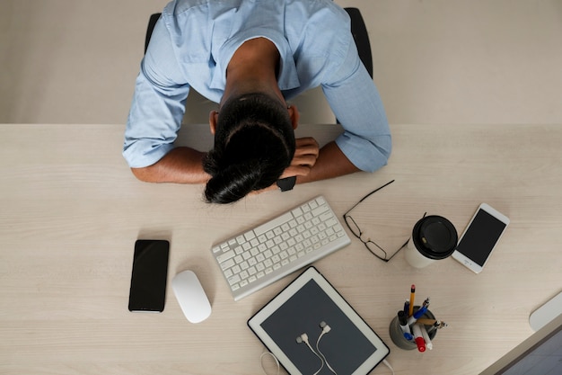 Man being tired after spending too much time on his phone