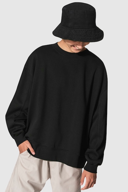 Free Photo man in black sweater and black bucket hat youth apparel shoot