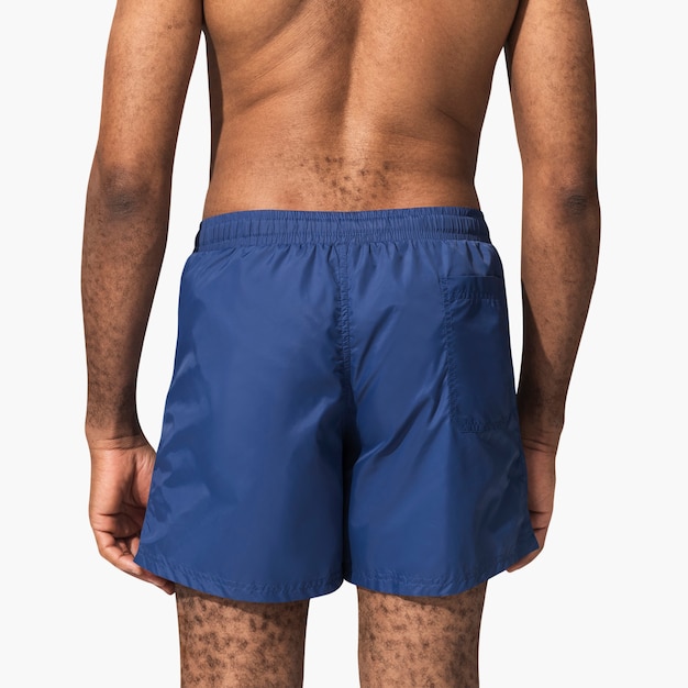 Free Photo man in a blue swim shorts back view