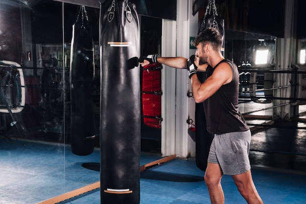 Man boxing in gym