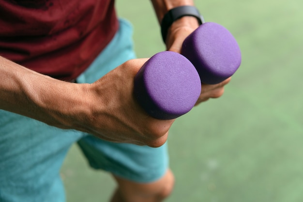 Man boxing with dumbbells. bali