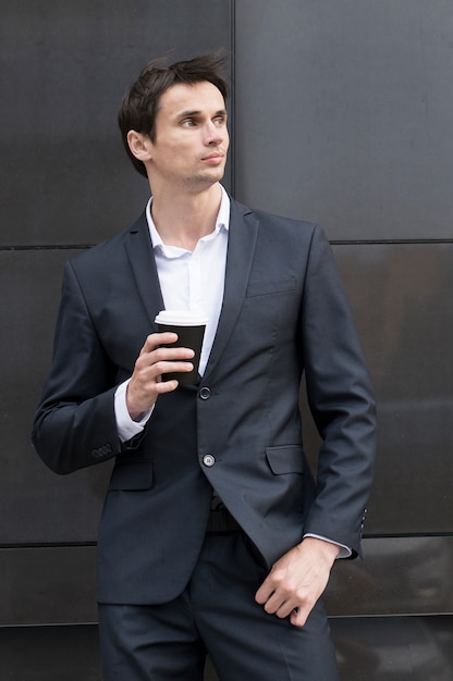 Man on break drinking a cup of coffee