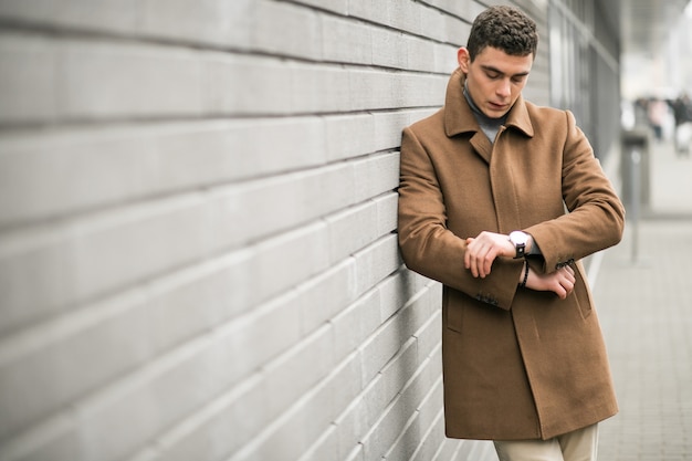 Free Photo man in brown coat