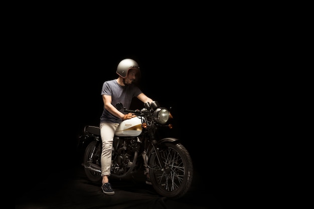 Man on cafe racer style motorbike