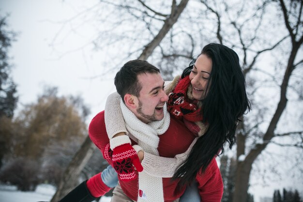 Man carrying girlfriend on back