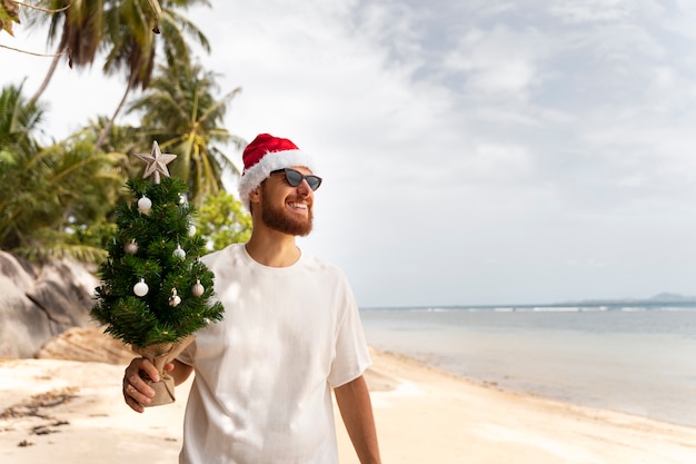 Man celebrating christmas in july